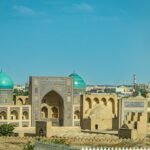 A historic building with a blue dome in Bukhara