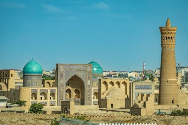 A historic building with a blue dome in Bukhara