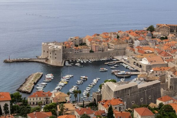 Dubrovnik old harbour with boats and stone buildings