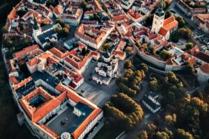 Aerial view of red roofs and church spires in Tallinn Old Town