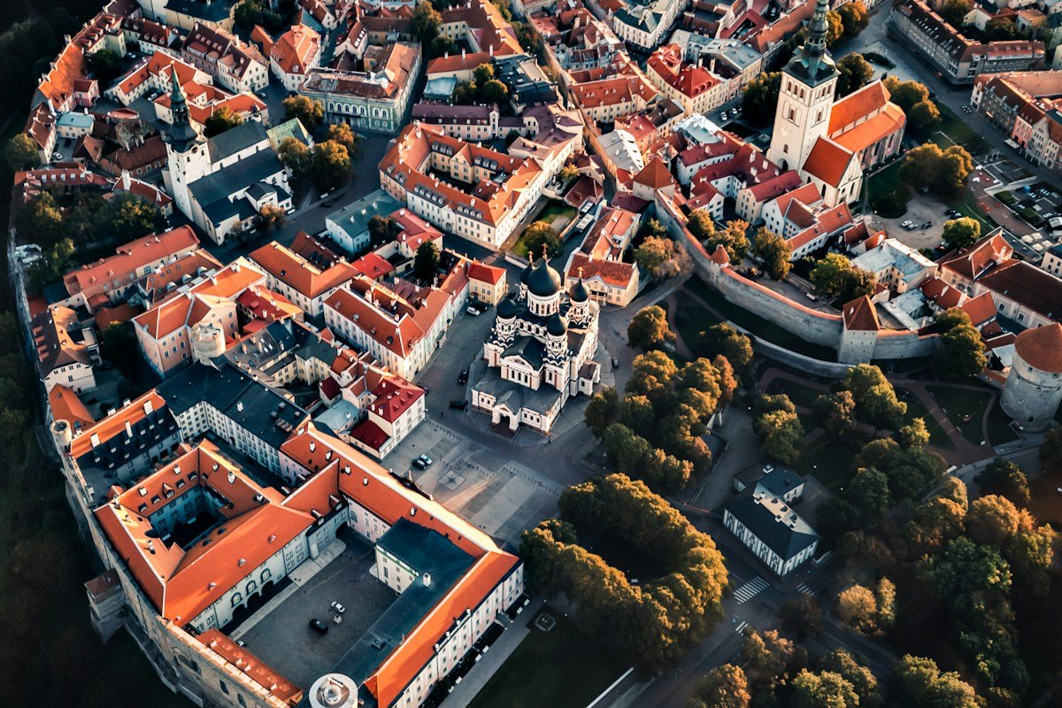 Aerial view of red roofs and church spires in Tallinn Old Town